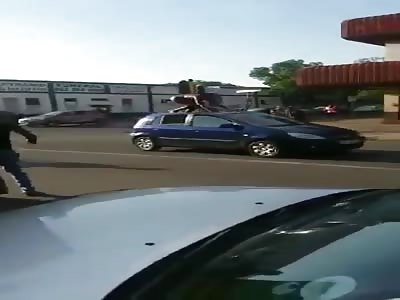 BLACK WOMAN in South Africa undressed herself in public, jumped on som