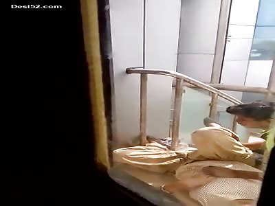 horny couple caught playing in the stairs