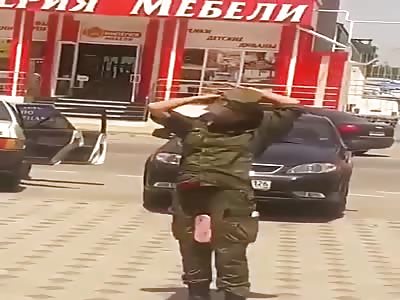 Russian military woman after day of work and a good bottle of vodka 