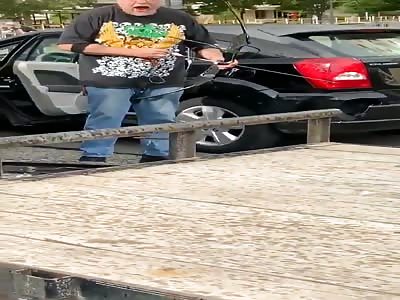 Crazy man treating and shoot protester with bow gets jumped 