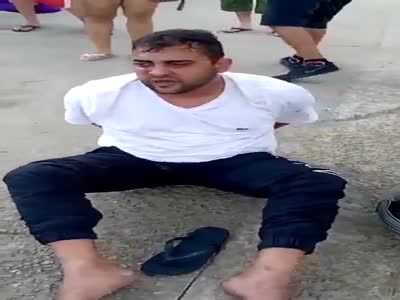 Arrested thief gets beating from angry old woman 