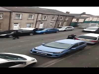 armed police stopping a car involved in suspected multiple crimes