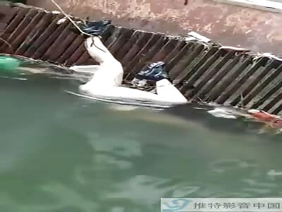 Removing dead body of female journalist drowned in river