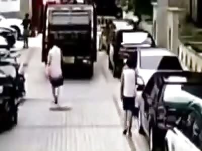 Woman crashed under trash truck 