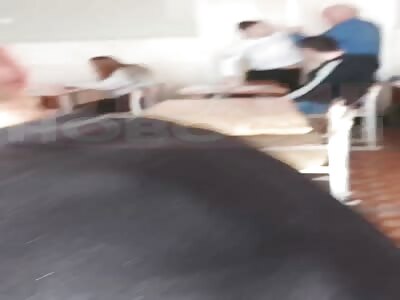 Teacher and student fighting in classroom 