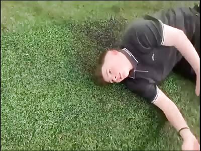 Guy has a full blown Seizure after getting Knocked on the Football pit