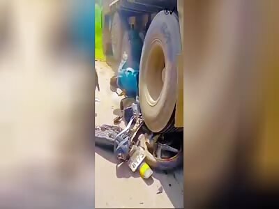 CORPSE AND MOTORCYCLE WRECKAGE AFTER ACCIDENT 