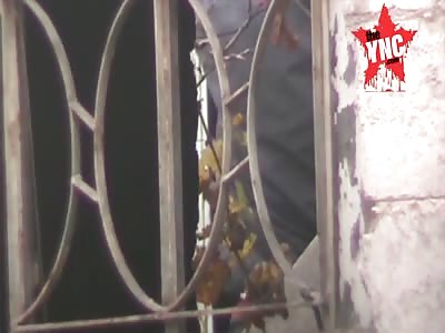 sniper element of the factions in front of the appropriate facilities in the _Alarmuk camp south of the city of Damascus