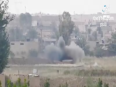 A bulldozer of the Syrian army is damaged by a guided missile on the outskirts of the city of Albuqamal