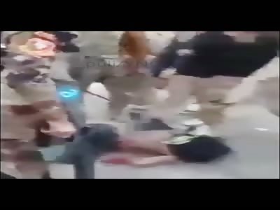 Alleged ISIS teen dragged through the street, beat, and shot by Iraqi soldiers.