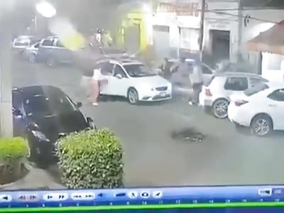 He is shot in the head, loses control of the car and runs over several