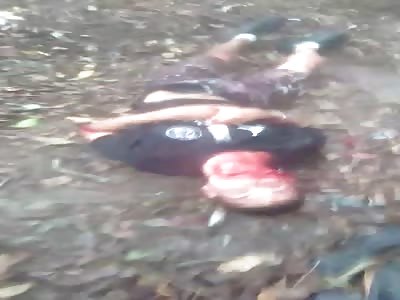 Gang Member Cowers on Floor, Machete Cuts into His by Rival