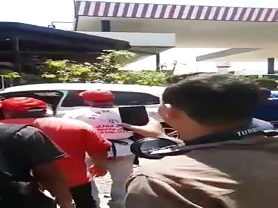 Man receives shots inside his car