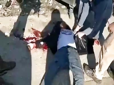 executed a young Palestinian on one of the military barriers