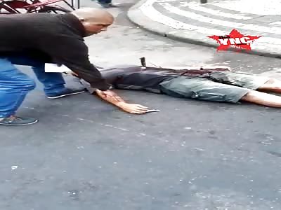 Man in agony. With a knife stuck in the stomach