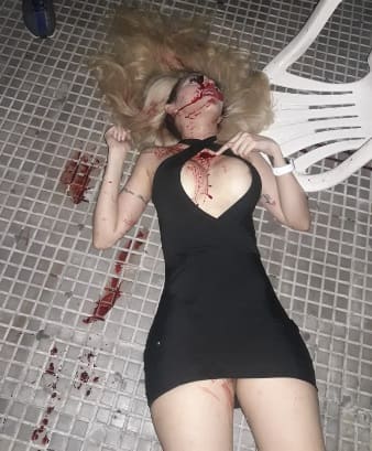 Pretty Young Woman with Nice Breasts Riddled with Bullets