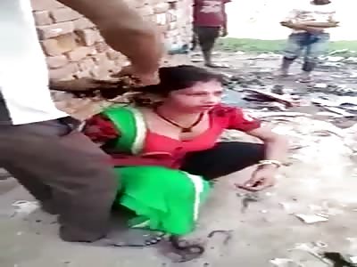 Woman punished with haircut.