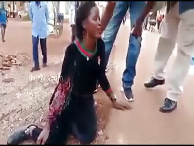 woman in agony after being shot by gas bomb