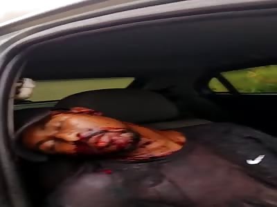 Two people are killed with several shots inside their car