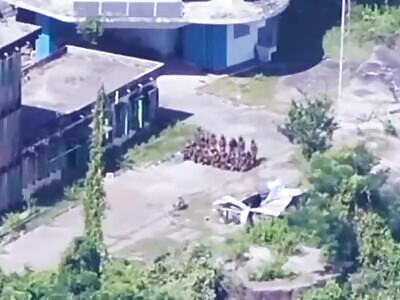 SOLDIERS FORMING UP FOR A PHOTO ARE HIT BY AN EXPLOSION