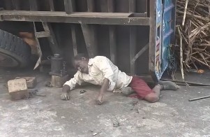 JUST A MAN TRAPPED UNDER TRUCK AND NOBODY CARES