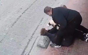 MAN BEING BEATEN TO DEATH IN BROAD DAY LIGHT