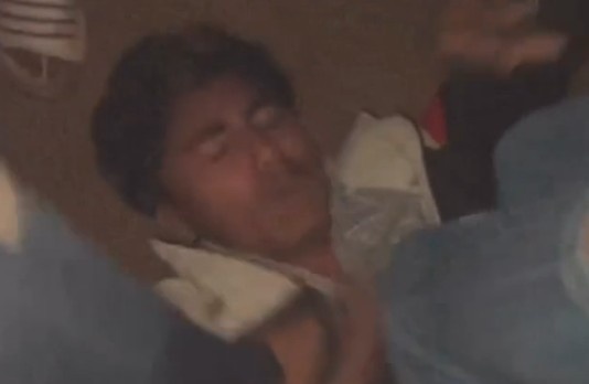 MAN TIED UPSIDE DOWN AND BEING TORTURED