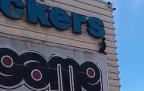 MAN FALLS AT LEAST TWO STOREYS