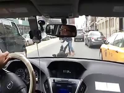 OUCH !! GUY GETS BEAT DOWN WITH LARGE HAMMER ON A BUSY STREET