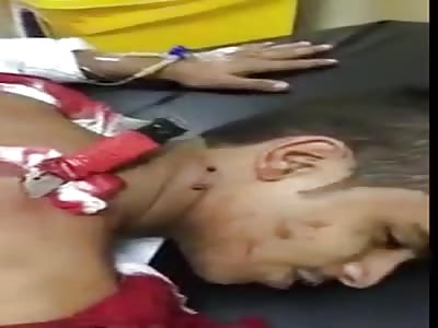 Man with knife stuck in neck