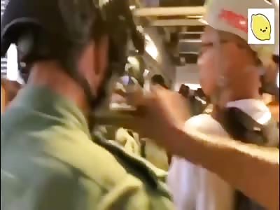 Hong Kong Protester Stabs Cop In The Neck