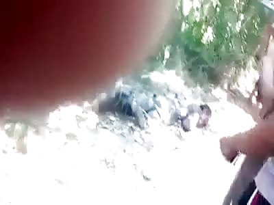 A Tied Up Man Gets Beaten With A Stick