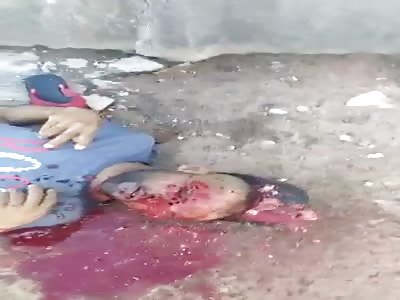 Gang Member Kicks The Head Of Already Dead Rival With His Brains Blown Out