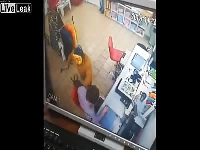 Four vendors arrested a robber wearing a cat mask armed with an ax