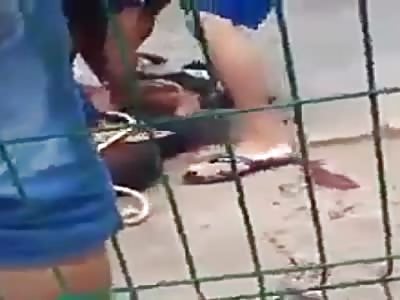 Thief beaten and tied by popular