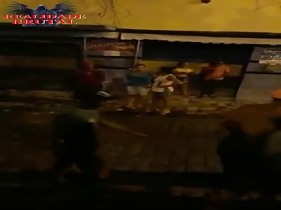 Man being stabbed in street fight