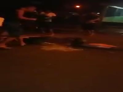 man brutally beating with sticks