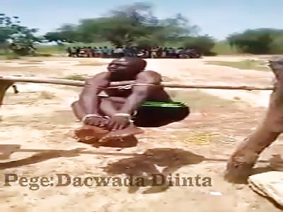 Man being tortured in macaw wood