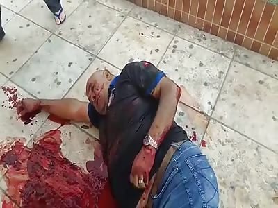 bank security and shot by assailants