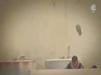 Isis sniper  soldier takes a shot and his cap goes in the clouds