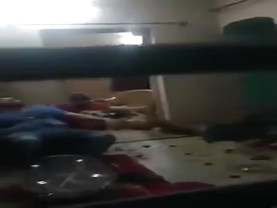 Indian guy sits in his chair calmly  next  to the African Girl he's just murderd