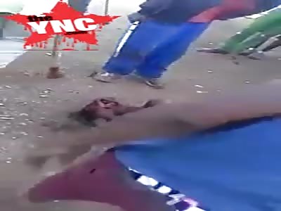 mans head crushed with a large cement block 