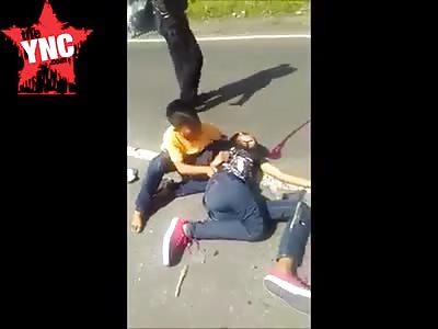 boy cry's next to his dying brother