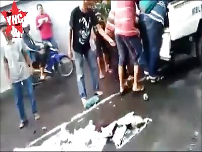 aftermath dead body put onto the back of a white pick up