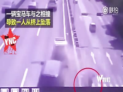 vehicle on an overpass is hit from behind throwing one of the workers onto the road below