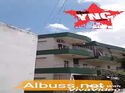 [long shot] black woman trying to cut her own neck in Iran