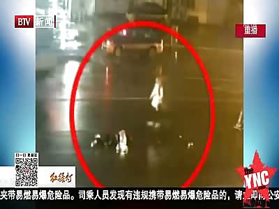 friends standing in the middle of moving traffic get run   over by a big truck 