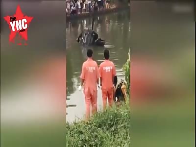 Dead Body falls out of car when they retrieve it out of river @1:31 mark