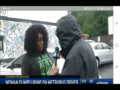 a black Woman throws cup of urine over bus driver after he told her to 'have a nice day'