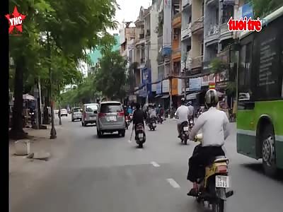 a man in Vietnam trying cause problems  by cutting of Wing mirrors with a machete 